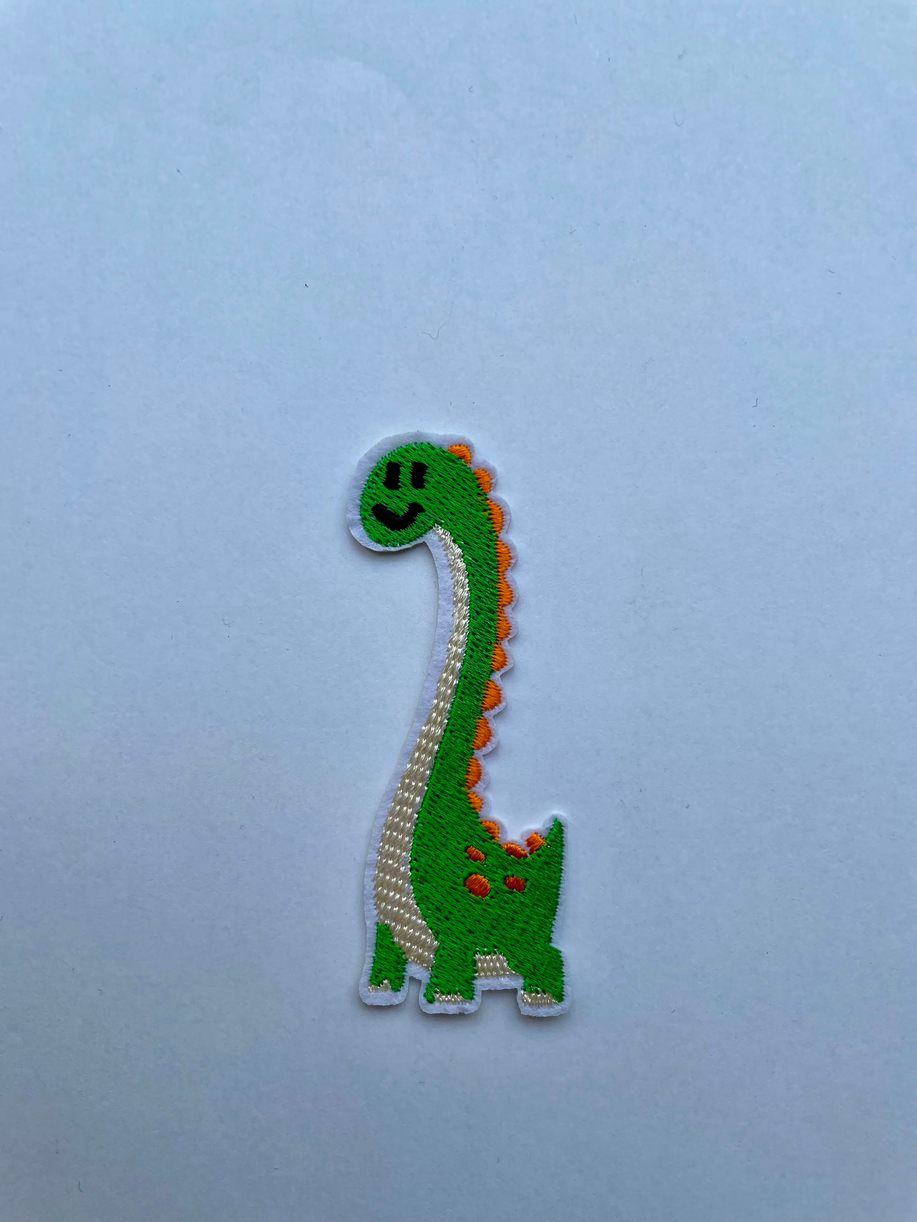 Dinosaurus kangasmerkki vihreä