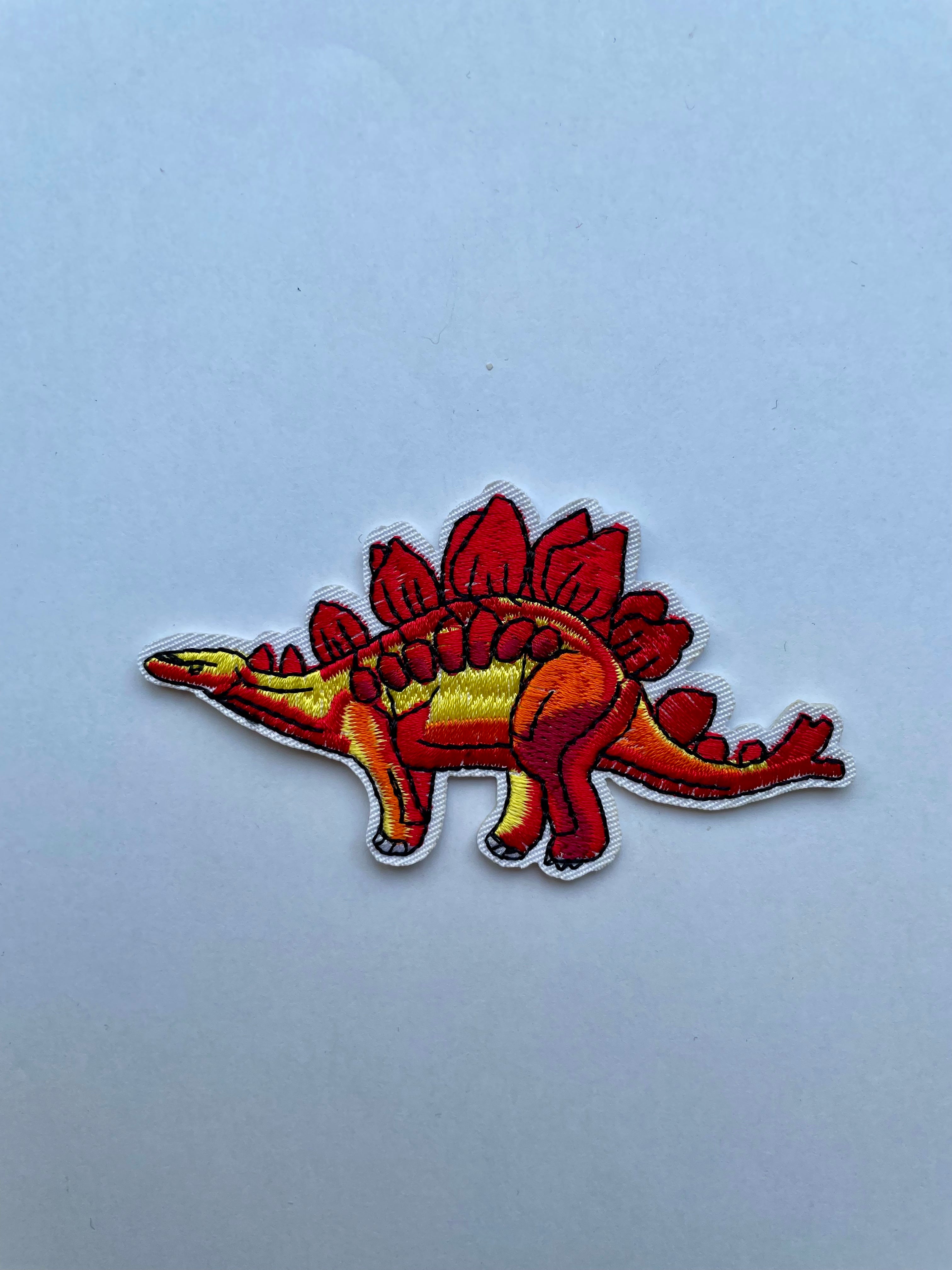 Stegosaurus kangasmerkki