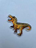 T-rex kangasmerkki keltainen